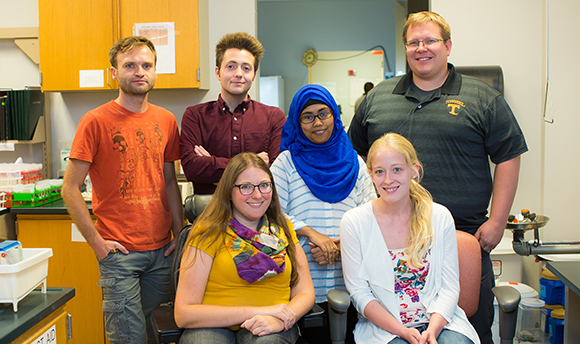 Group Lab Photo: (pictured left to right, top to bottom) Marcin, Nicholas, Meher, Sarah, Bethany