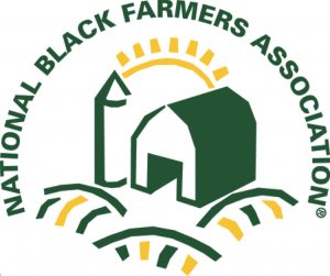 Logo for the National Black Farmers Association: a small green farm with a sunrise behind it.