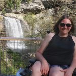 Sarah pictured in front of a waterfall